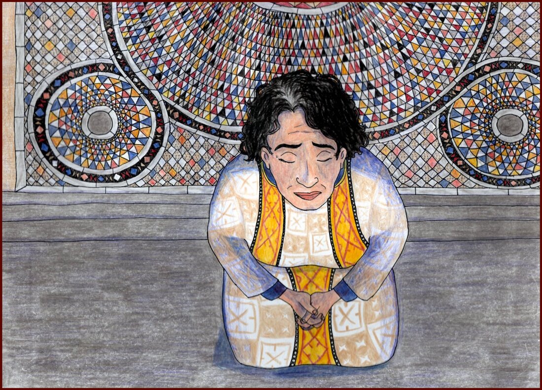 Picture. A middle-aged white woman with greying black hair kneels in the foreground. She is wearing a white, red and gold dalmatic decorated with geometric patterns over a blue tunic. Behind her is the floor of the church, where there are swirling patterns of tiles in blue, black, red, gold, grey and pink.